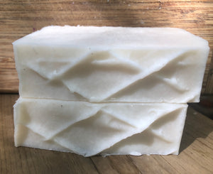 white plain bar of soap with lattice crisscross on top